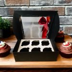 6-hole cupcake box with red ribbon bow, ideal for gifting and showcasing cupcakes