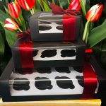 12-hole cupcake box with red ribbon bow for gifting and special occasions.