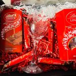 Lindor chocolate sweet gift box with personalized etched wine glass for him or her.